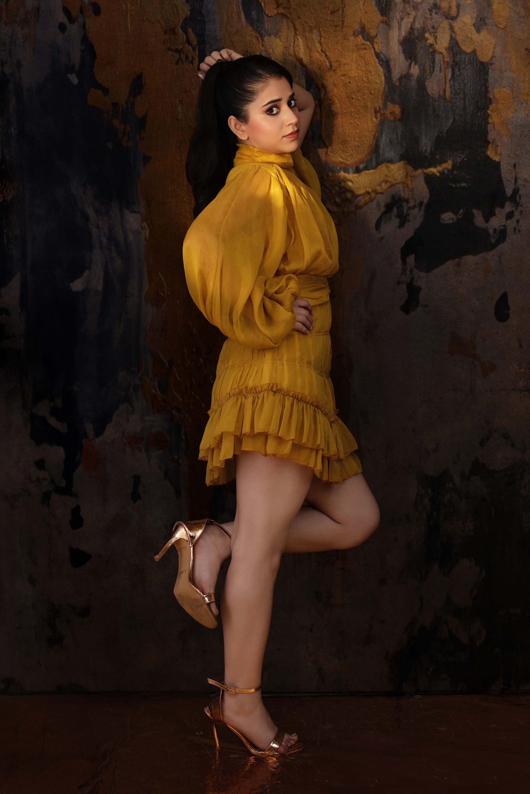 Neeru Sharma in a mustard dress, dynamic pose